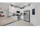 Well-equipped kitchen featuring white cabinets, granite counters, and stainless steel appliances at 317 Goddard Ln., Murrells Inlet, SC 29576