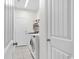 Laundry room with washer, dryer, and additional shelving at 317 Goddard Ln., Murrells Inlet, SC 29576