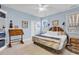 Main bedroom with large bed, rustic headboard, and ceiling fan at 317 Goddard Ln., Murrells Inlet, SC 29576