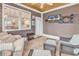 Bright sunroom with comfortable seating and a large screen TV at 317 Goddard Ln., Murrells Inlet, SC 29576