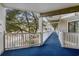 Outdoor condo hallway with trees and parking in the background at 415 Ocean Creek Dr. # 2236, Myrtle Beach, SC 29572