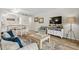 Cozy living room featuring a dining table, wicker coffee table, and 