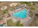 Large pool with plenty of lounge chairs and a hot tub at 415 Ocean Creek Dr. # 2236, Myrtle Beach, SC 29572