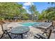 Community pool area with patio furniture and seating at 415 Ocean Creek Dr. # 2236, Myrtle Beach, SC 29572