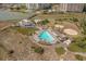 Resort-style pool with surrounding lounge chairs at 415 Ocean Creek Dr. # 2236, Myrtle Beach, SC 29572