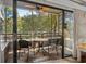 Relaxing screened porch with outdoor seating and lovely wooded views at 415 Ocean Creek Dr. # 2236, Myrtle Beach, SC 29572