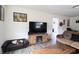 Living room featuring a TV, fireplace, coffee table, couch, and pet bed at 4738 White Pine Dr., Myrtle Beach, SC 29588