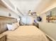 Spacious bedroom with a queen bed and sitting area at 4800 S Ocean Blvd. # 611, North Myrtle Beach, SC 29582