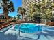 Octagonal hot tub surrounded by a tiled deck at 4800 S Ocean Blvd. # 611, North Myrtle Beach, SC 29582