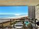 Breathtaking ocean view from balcony, featuring beach, pools, and resort amenities at 4800 S Ocean Blvd. # 611, North Myrtle Beach, SC 29582