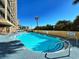 Relaxing outdoor pool with steps for easy access at 4800 S Ocean Blvd. # 611, North Myrtle Beach, SC 29582