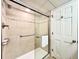 Walk-in shower with grab bars and tiled walls at 4800 S Ocean Blvd. # 611, North Myrtle Beach, SC 29582