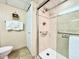Walk-in shower with grab bars and tiled walls at 4800 S Ocean Blvd. # 611, North Myrtle Beach, SC 29582