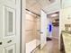 Walk-in shower with grab bars and tiled walls at 4800 S Ocean Blvd. # 611, North Myrtle Beach, SC 29582