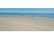 Expansive sandy beach with ocean waves at 5200 N Ocean Blvd. # 1134, Myrtle Beach, SC 29577