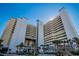 Multi-story building with oceanfront views and palm trees at 5200 N Ocean Blvd. # 1134, Myrtle Beach, SC 29577