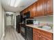 Fully equipped kitchen with dark wood cabinets at 5200 N Ocean Blvd. # 1134, Myrtle Beach, SC 29577