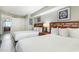Bedroom with two double beds, offering a view into the kitchen at 5300 N Ocean Blvd. # 1011, Myrtle Beach, SC 29577