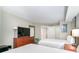Bedroom with two double beds and a flat screen TV at 5300 N Ocean Blvd. # 1011, Myrtle Beach, SC 29577
