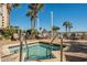 Relaxing hot tub area with palm trees at 5300 N Ocean Blvd. # 1011, Myrtle Beach, SC 29577
