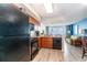 Kitchen features dark appliances and wood cabinets at 5300 N Ocean Blvd. # 1011, Myrtle Beach, SC 29577