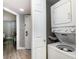 Compact laundry room with stacked washer and dryer at 5300 N Ocean Blvd. # 1011, Myrtle Beach, SC 29577