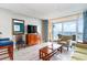 Living room with ocean view and access to balcony at 5300 N Ocean Blvd. # 1011, Myrtle Beach, SC 29577