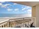 Balcony view of the ocean and sandy beach at 5300 N Ocean Blvd. # 1011, Myrtle Beach, SC 29577
