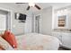Bedroom with wall-mounted TV and ensuite bathroom, perfect for relaxation at 6001 - 5326 S Kings Hwy., Myrtle Beach, SC 29575