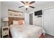A cozy bedroom with a ceiling fan, a wall-mounted TV, and beachy artwork at 6001 - 5326 S Kings Hwy., Myrtle Beach, SC 29575