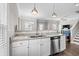 Granite countertops and white cabinets highlight this well-equipped kitchen at 6001 - 5326 S Kings Hwy., Myrtle Beach, SC 29575