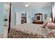 Main bedroom with floral bedding and ensuite bathroom access at 712 Algonquin Dr. # A, Pawleys Island, SC 29585
