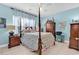 Charming bedroom with a floral-patterned bed and hardwood floors at 712 Algonquin Dr. # A, Pawleys Island, SC 29585