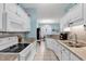 Bright eat-in kitchen with granite countertops and white cabinetry at 712 Algonquin Dr. # A, Pawleys Island, SC 29585