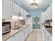 Well-equipped kitchen featuring granite countertops and white cabinets at 712 Algonquin Dr. # A, Pawleys Island, SC 29585
