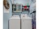 Laundry room with washer, dryer, and shelves at 712 Algonquin Dr. # A, Pawleys Island, SC 29585