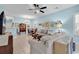 Spacious living room with light blue walls and a ceiling fan at 712 Algonquin Dr. # A, Pawleys Island, SC 29585