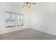 Bright bedroom with carpet flooring and two large windows at 865 Summer Starling Pl., Myrtle Beach, SC 29577