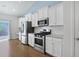 Modern kitchen with stainless steel appliances and white shaker cabinets at 865 Summer Starling Pl., Myrtle Beach, SC 29577