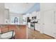 Modern kitchen with white cabinets, stainless steel appliances, and a breakfast bar at 865 Summer Starling Pl., Myrtle Beach, SC 29577