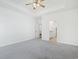 Main bedroom with grey carpet, ceiling fan and ensuite bathroom access at 865 Summer Starling Pl., Myrtle Beach, SC 29577