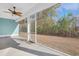 Screened porch overlooking backyard with ceiling fan at 865 Summer Starling Pl., Myrtle Beach, SC 29577
