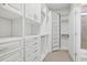 Large walk-in closet with white shelving and hanging rods at 865 Summer Starling Pl., Myrtle Beach, SC 29577