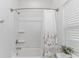 Clean bathroom with tub/shower combo, window, and decorative shower curtain at 935 Piping Plover Ln., Myrtle Beach, SC 29577