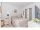Cozy bedroom with comfortable bed, white nightstands, and a large TV at 935 Piping Plover Ln., Myrtle Beach, SC 29577