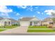 Charming light blue home with a covered porch and attached garage at 935 Piping Plover Ln., Myrtle Beach, SC 29577