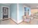 Welcoming front porch with seating area and black front door at 935 Piping Plover Ln., Myrtle Beach, SC 29577