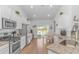 Bright, open kitchen with stainless steel appliances, white cabinetry, granite countertops at 935 Piping Plover Ln., Myrtle Beach, SC 29577