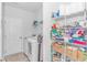 Laundry room with washer, dryer, wire shelving, and storage space at 935 Piping Plover Ln., Myrtle Beach, SC 29577