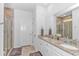 Spacious main bathroom with double vanity, granite countertops, and a glass shower at 935 Piping Plover Ln., Myrtle Beach, SC 29577